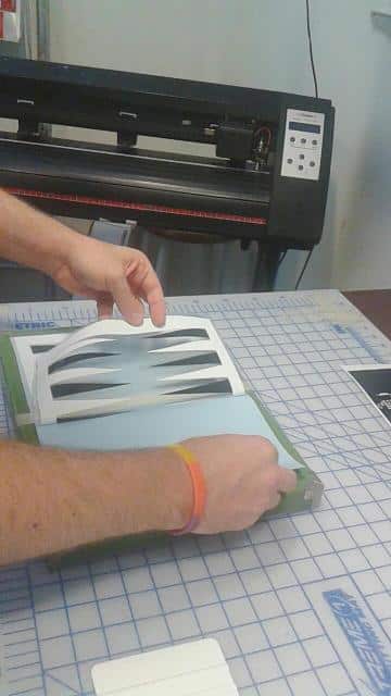 Applying backgammon vinyl decal